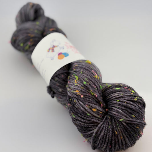 Hand Dyed Yarn, DK Weight, Superwash Merino and Neon Donegal Nep in Black Light