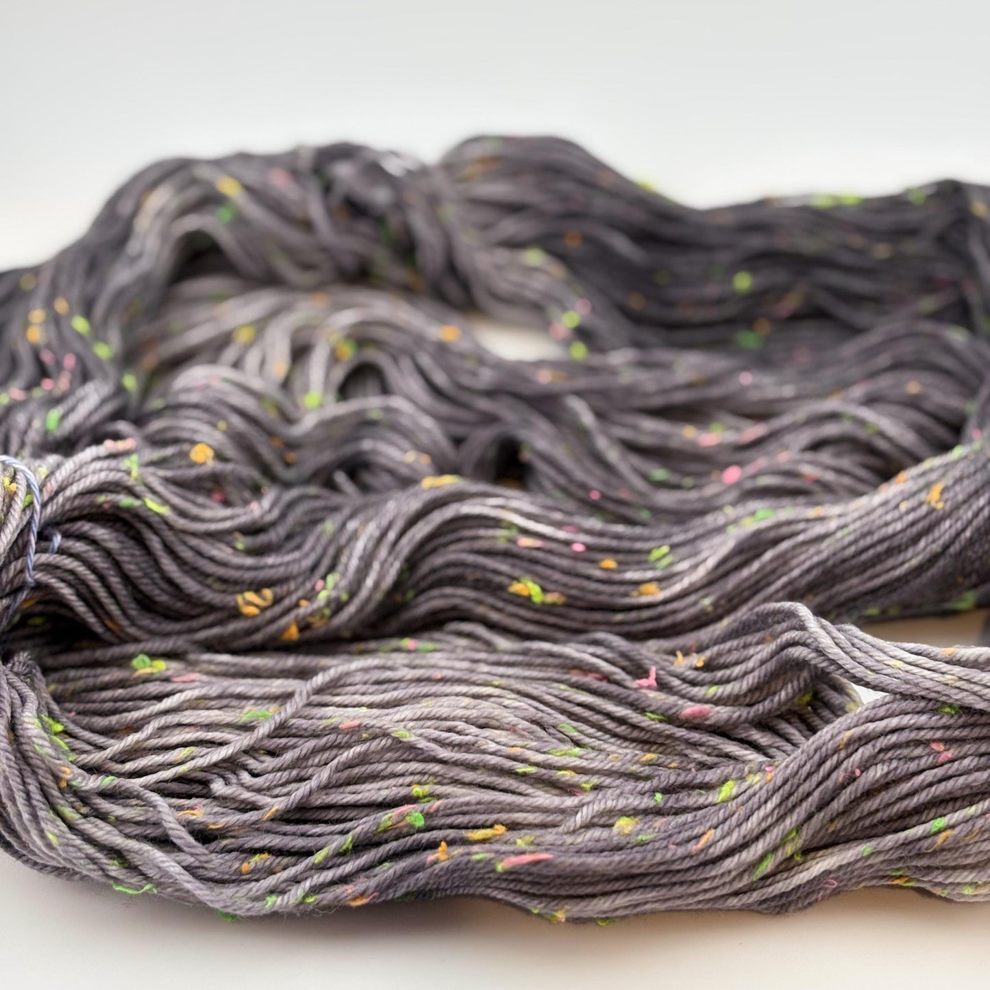 Hand Dyed Yarn, DK Weight, Superwash Merino and Neon Donegal Nep in Black Light