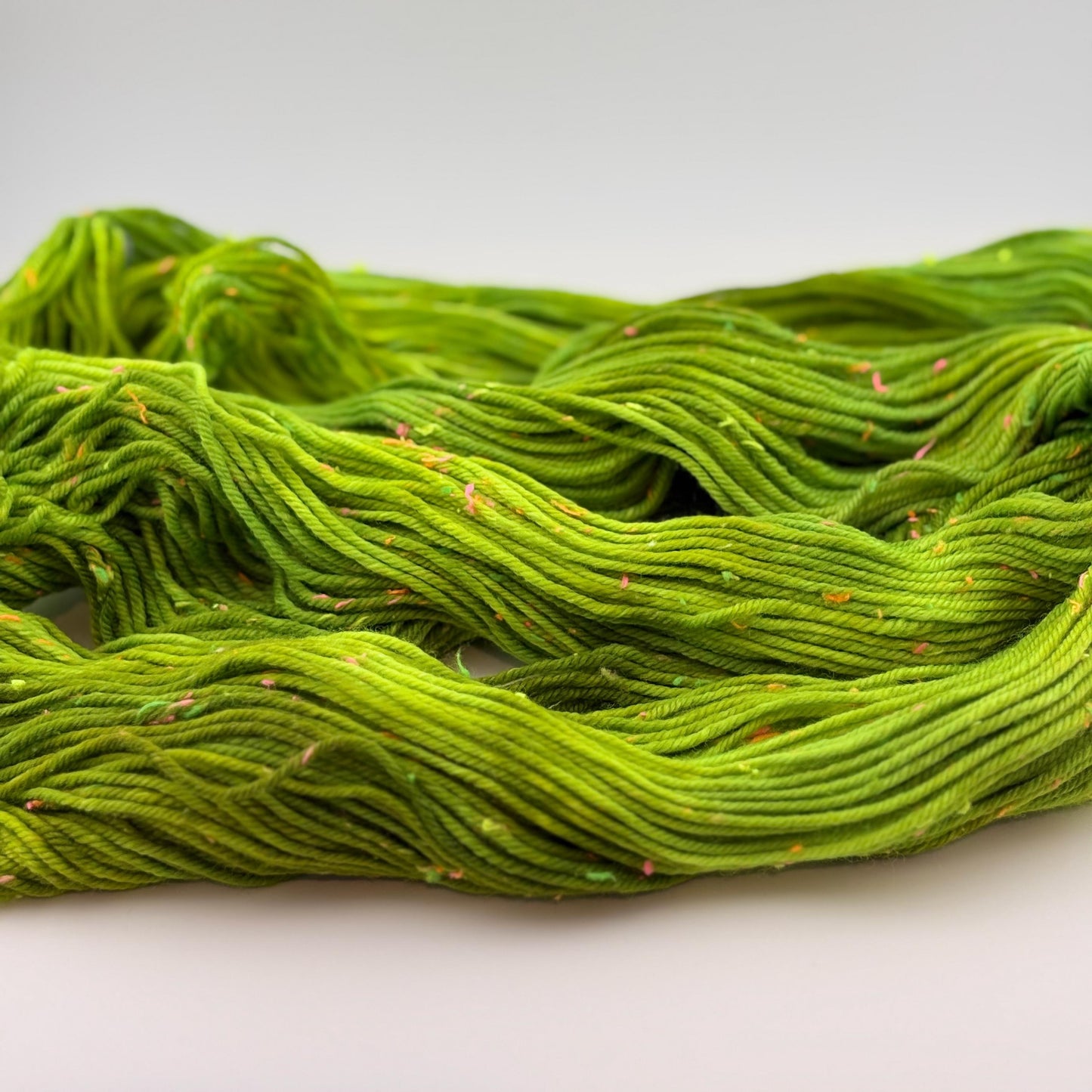 Hand Dyed Yarn, DK Weight, Superwash Merino and Neon Donegal Nep in Radioactive
