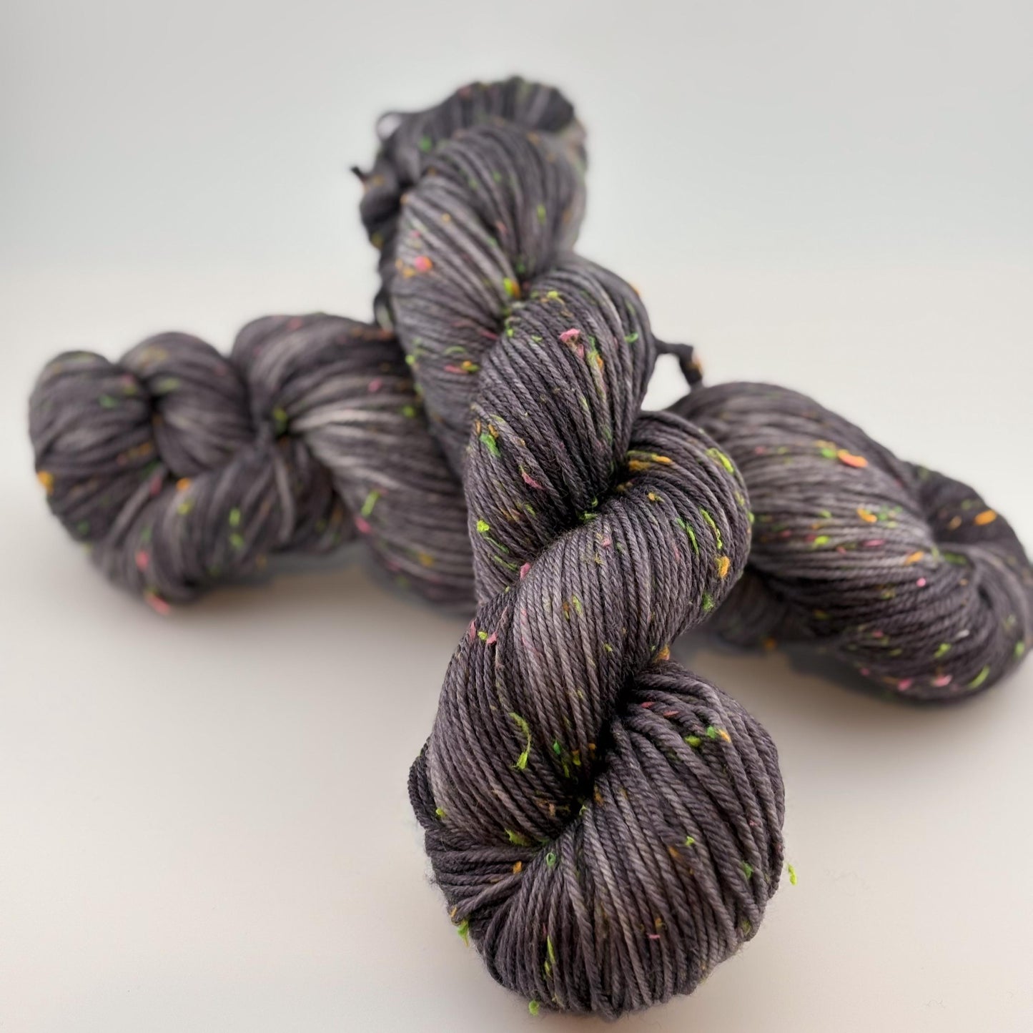 Hand Dyed Yarn, DK Weight, Superwash Merino and Neon Donegal Nep in Black Light